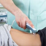 29593924 – close-up of a woman during laser physiotherapy, horizontal